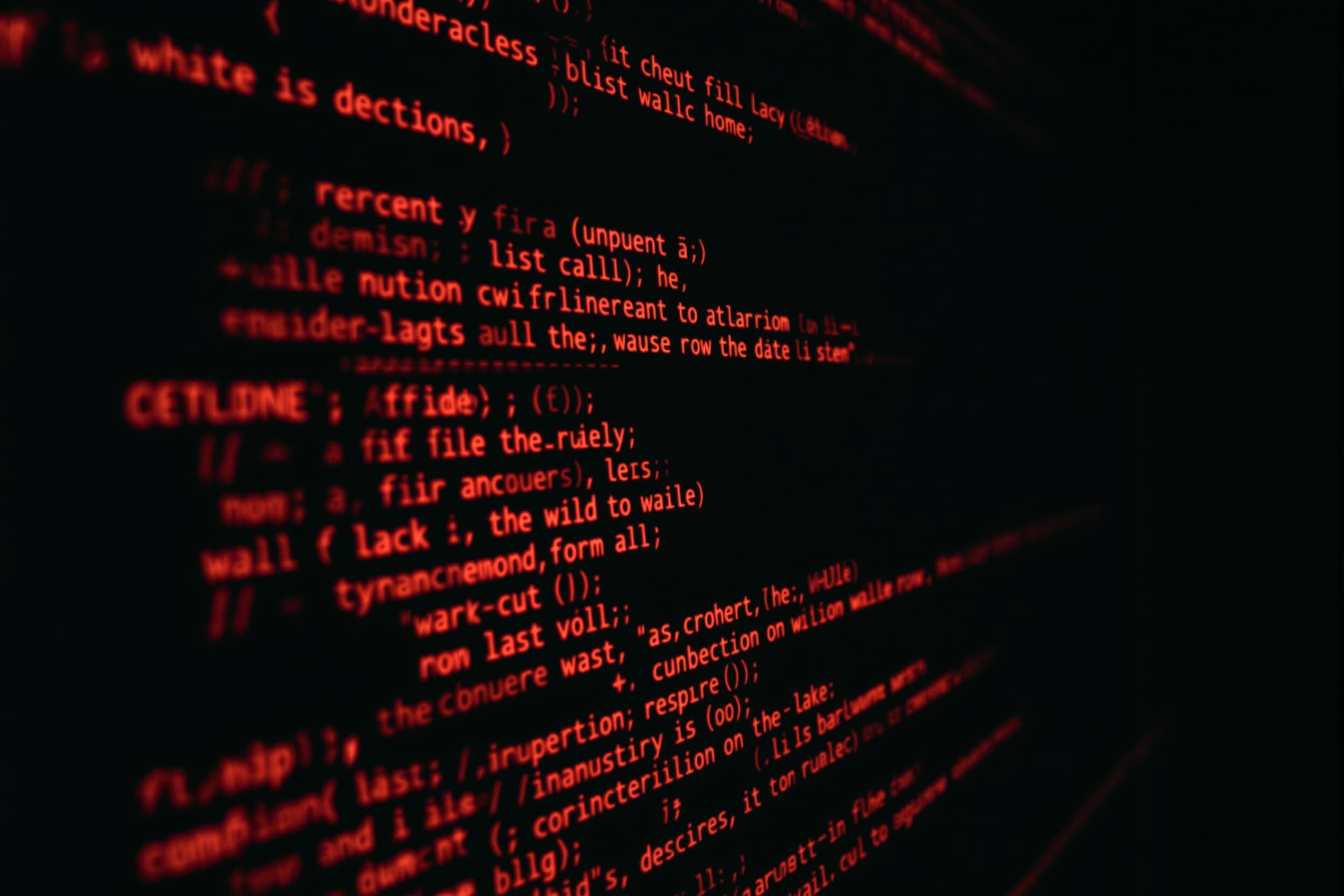 Glowing Red Code on Dark Screen