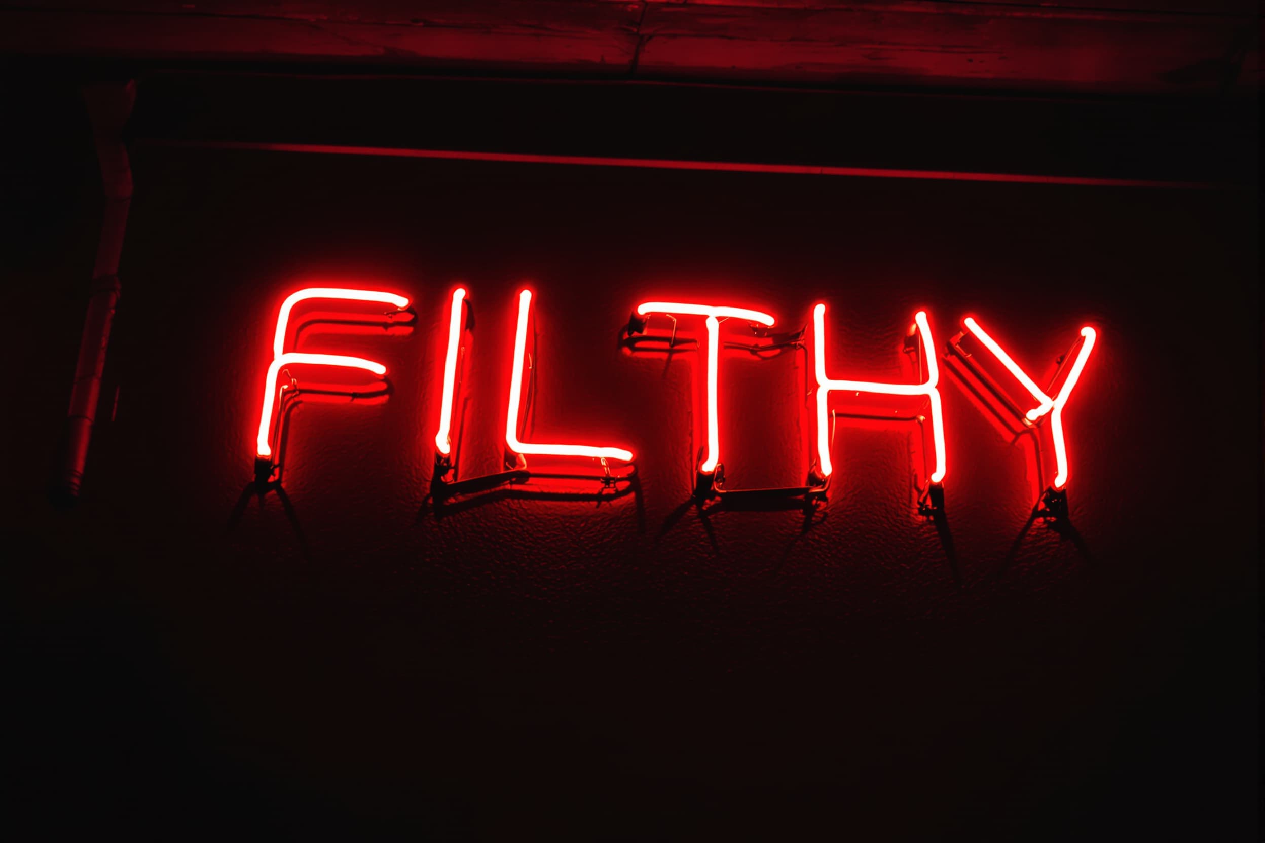 Vibrant Neon 'FILTHY' Sign