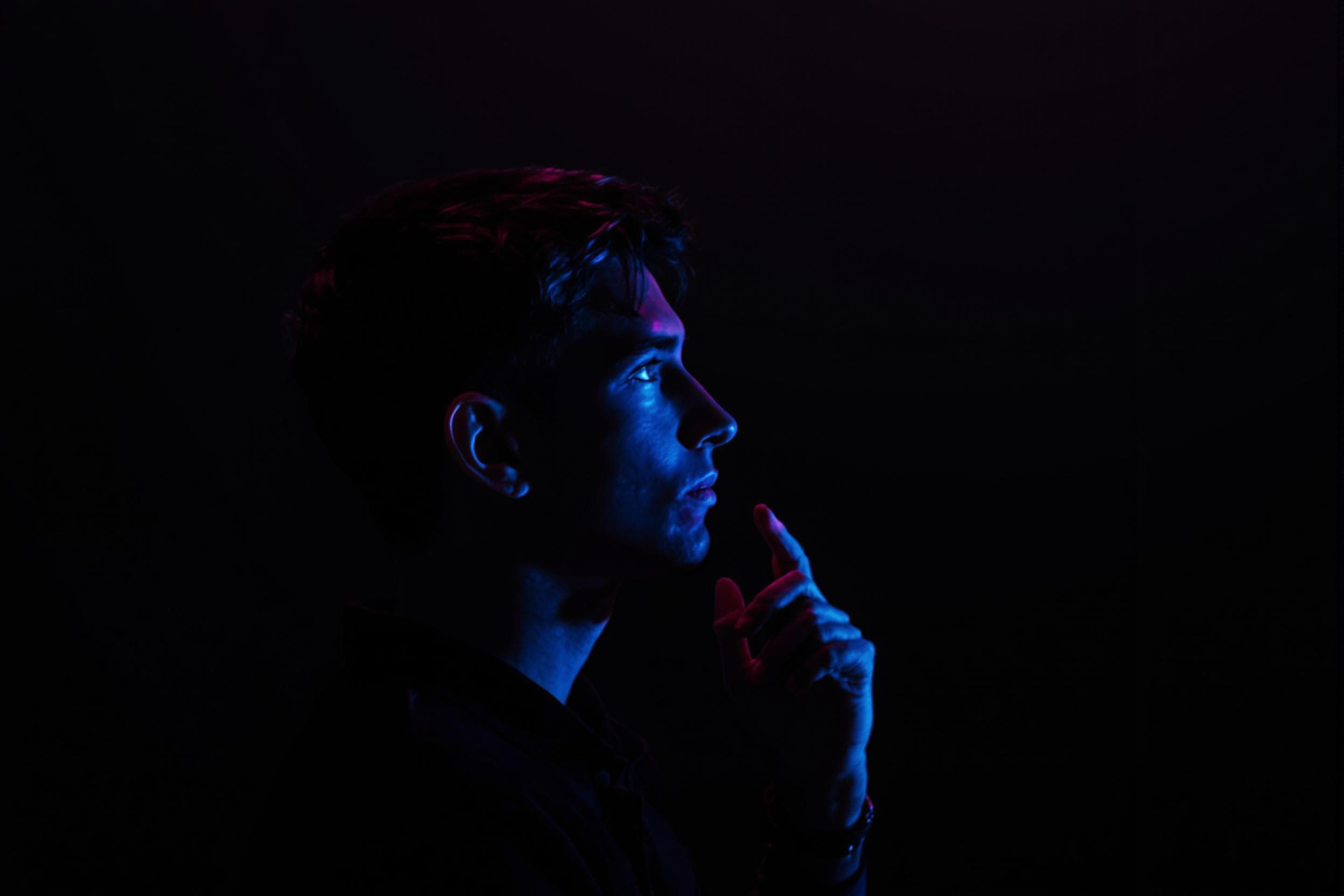Contemplative Portrait with Dramatic Lighting