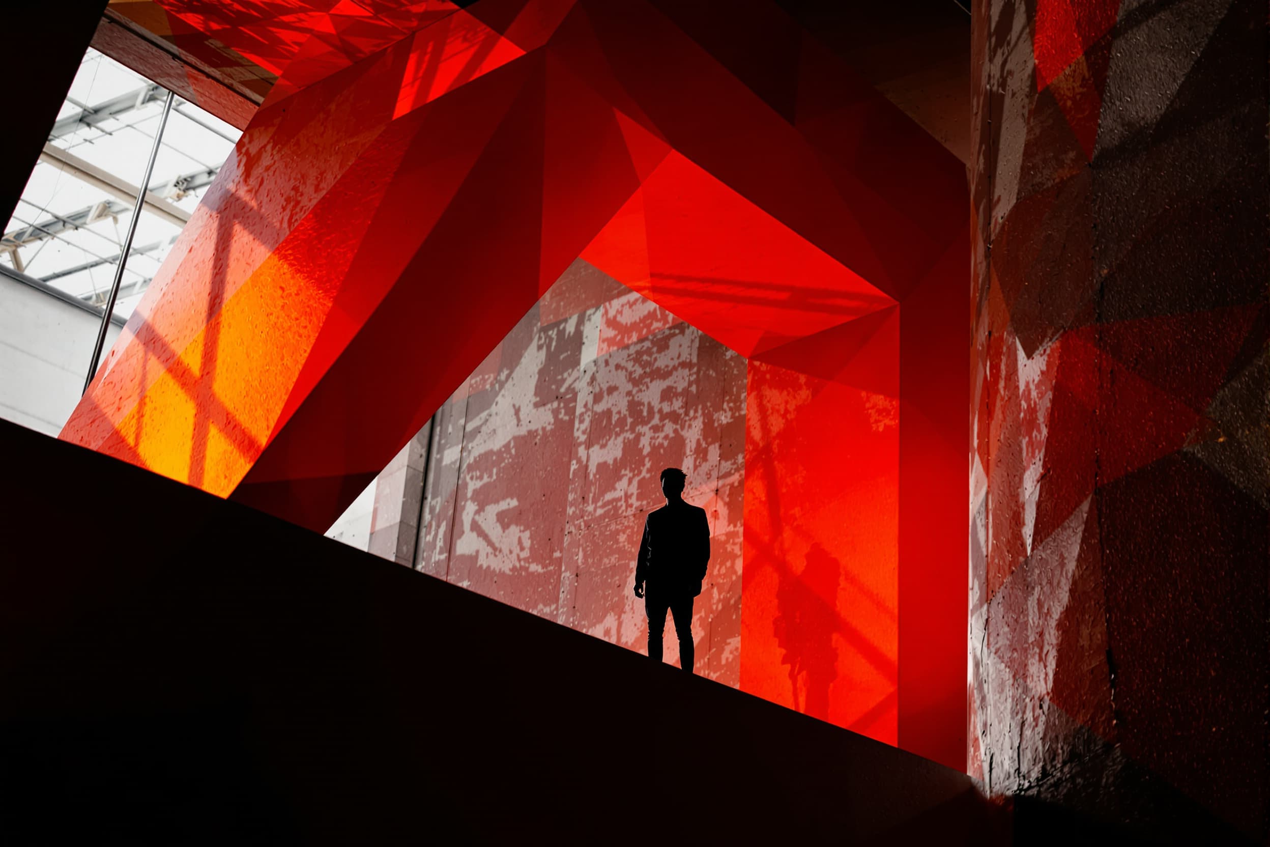 Lone Silhouette on Industrial Ledge