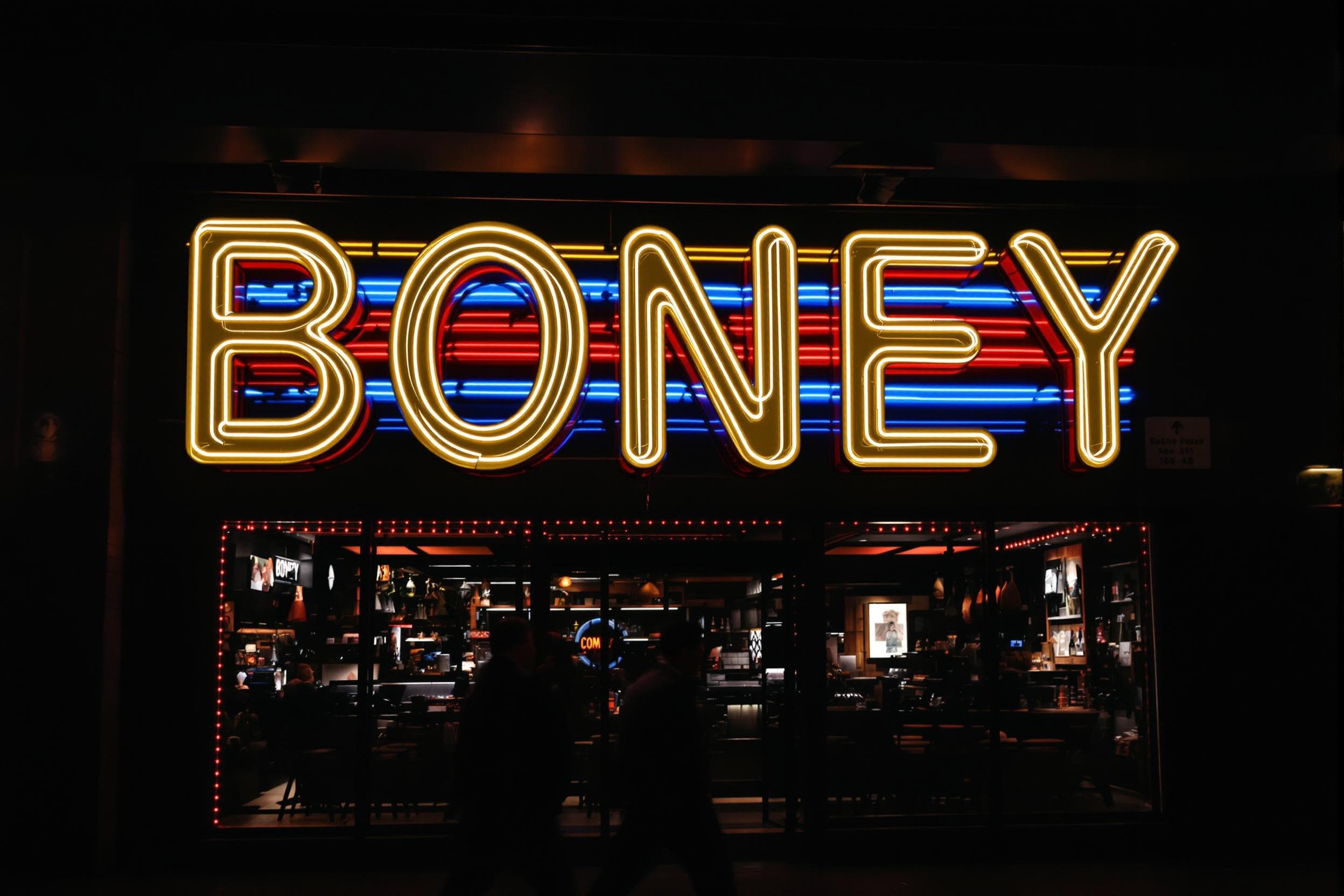 Vibrant Neon Storefront BONEY Sign
