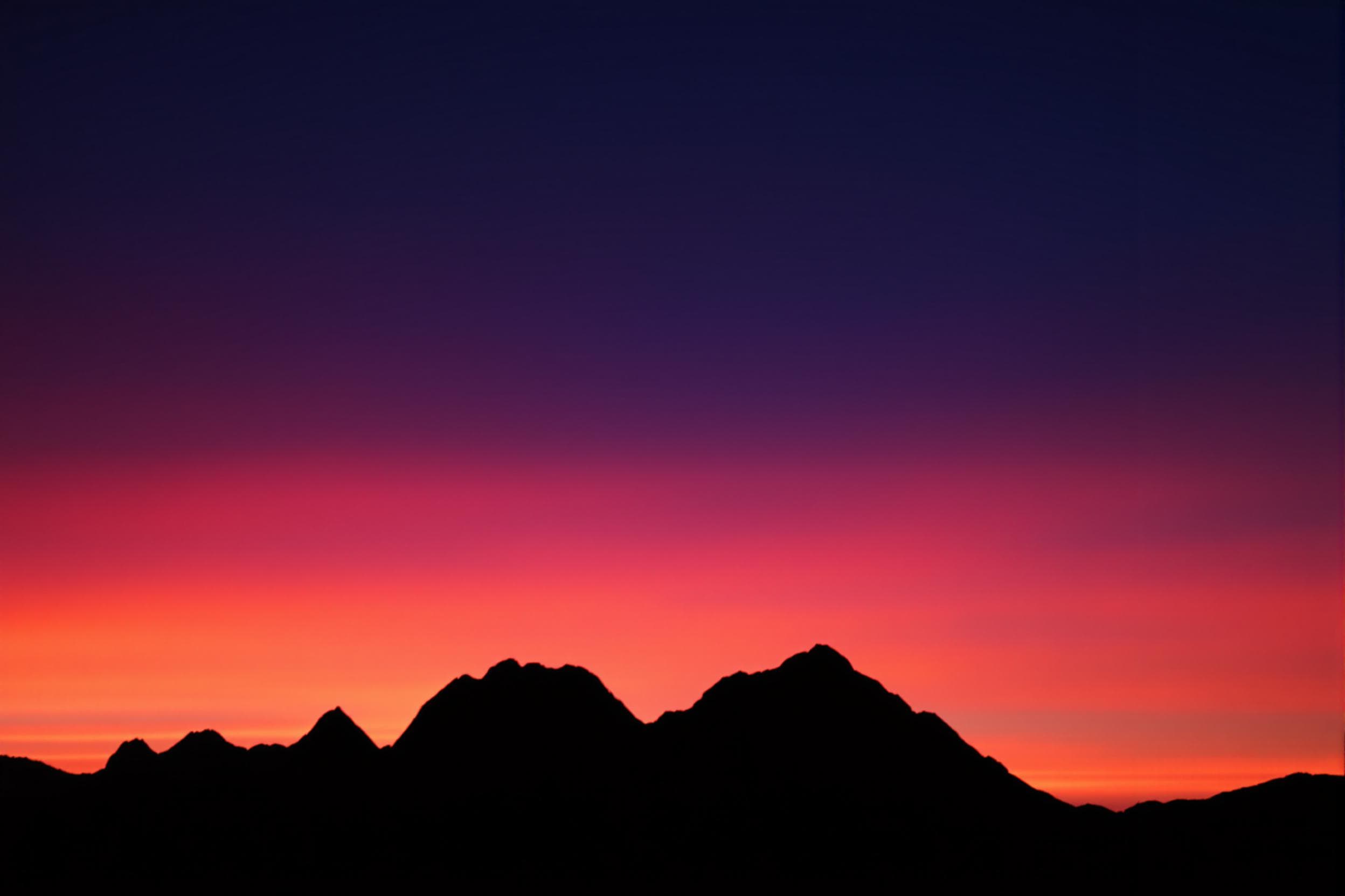 Tranquil Mountain Silhouettes at Sunset