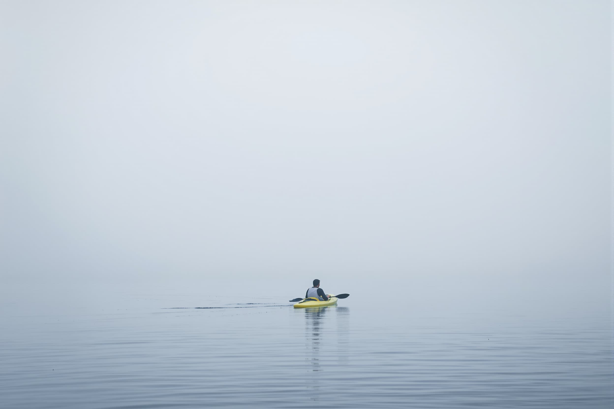 Solitary Kayaker on Tranquil Waters