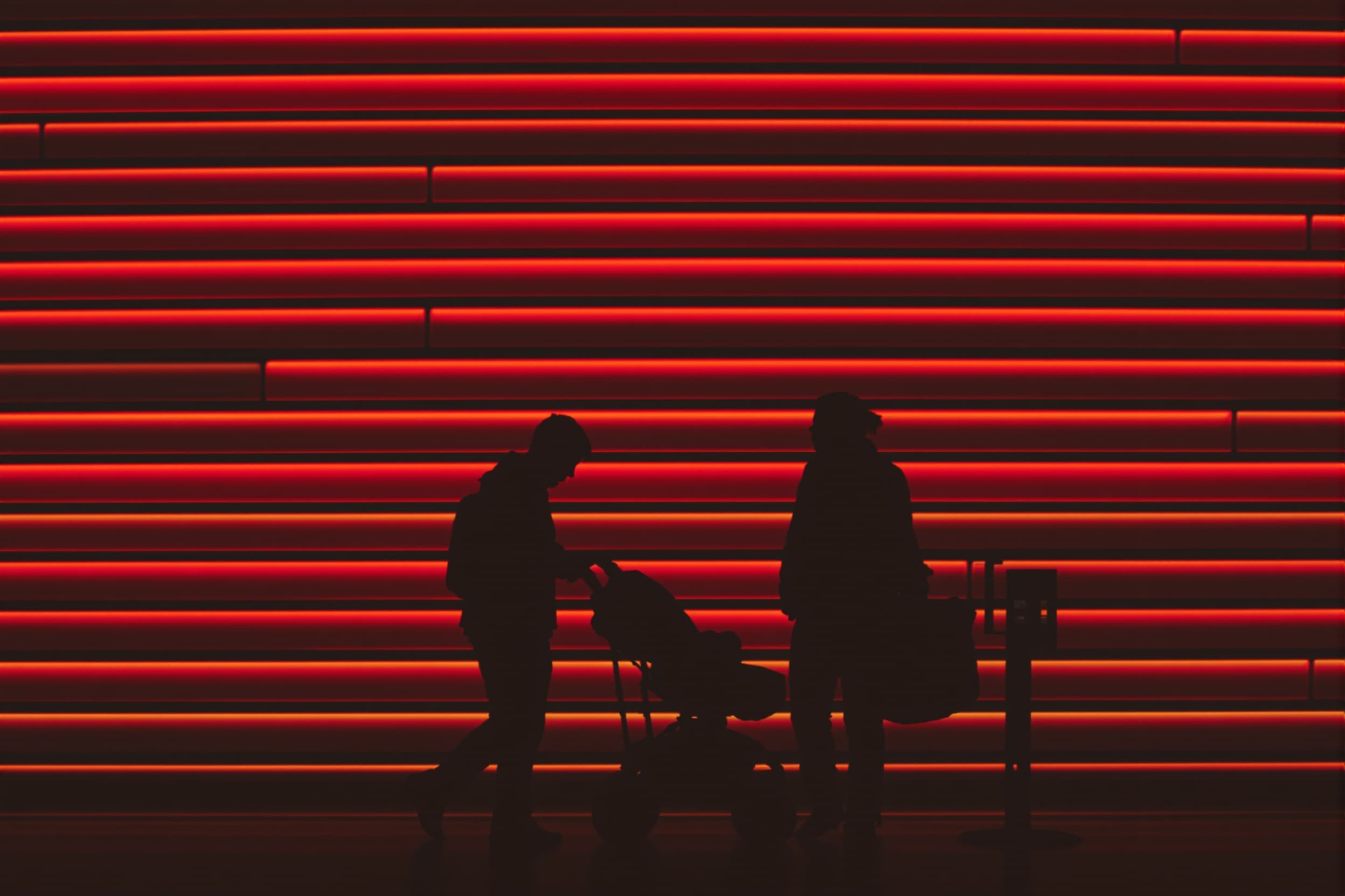 Silhouettes with Stroller Against Red Stripes