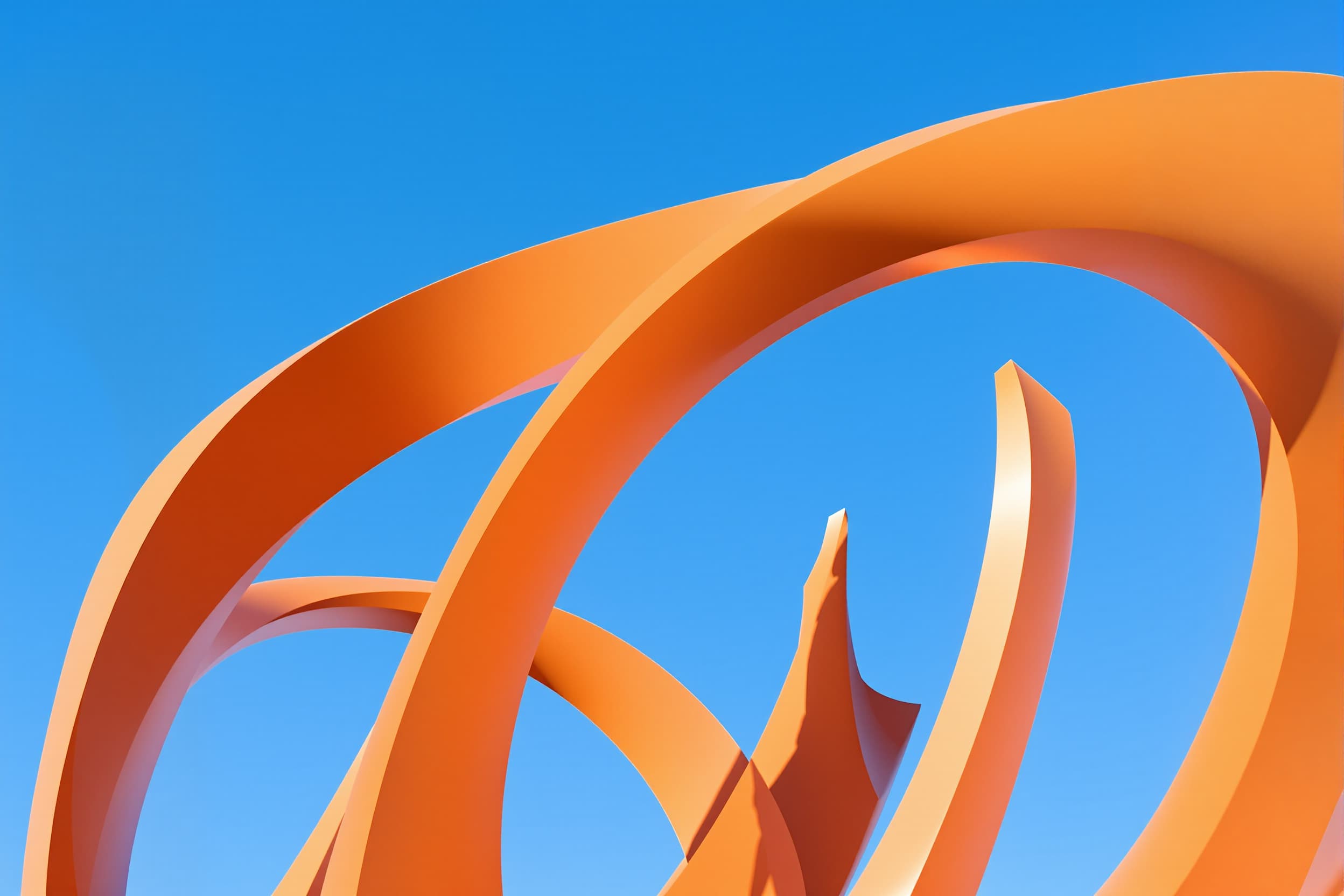Dynamic Abstract Sculpture Against a Blue Sky